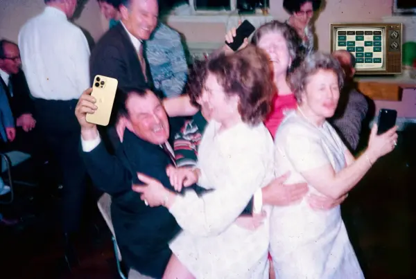 Friends dancing during a Plonkus trivia game night